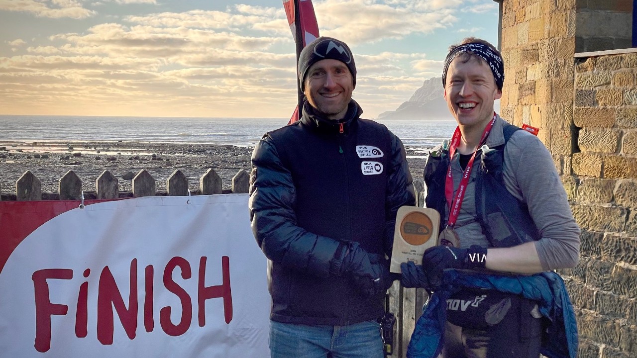 James Nobles is presented with the trophy at Robin Hood's Bay [©SILVA Northern and Lakes Traverse | No Limits Photography]