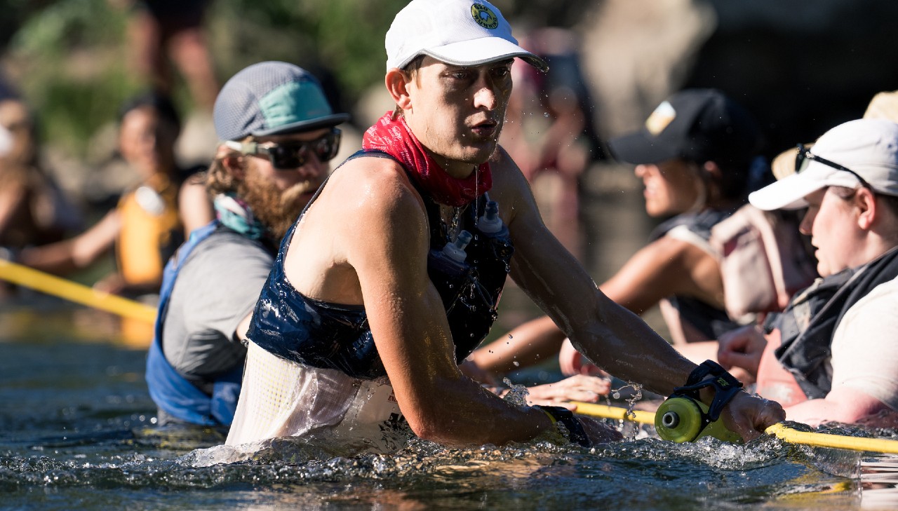 Runners cross the American River at the 2022 Western States