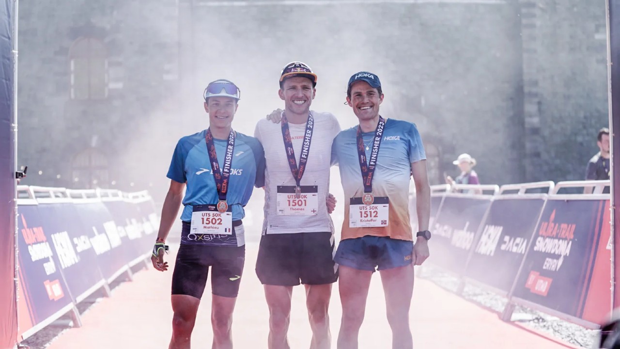 The 2023 Ultra-Trail Snowdonia by UTMB 50K podium, featuring Mathieu Delpeuch, Tom Evans and Kristoffer Eftedal