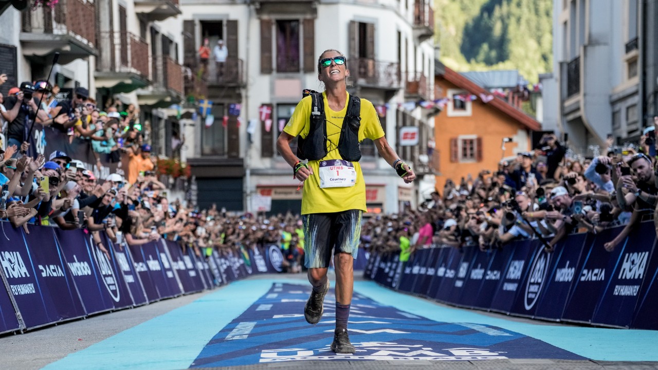 Courtney Dauwalter crosses the line to take victory at the 2023 UTMB