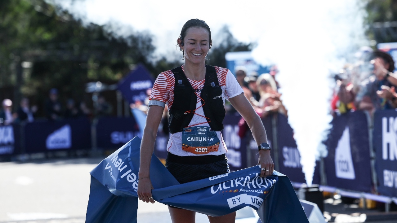 Caitlin Fielder claiming the win in the UTA50 at HOKA Ultra-Trail Australia 2025 photo credit Korupt Vision