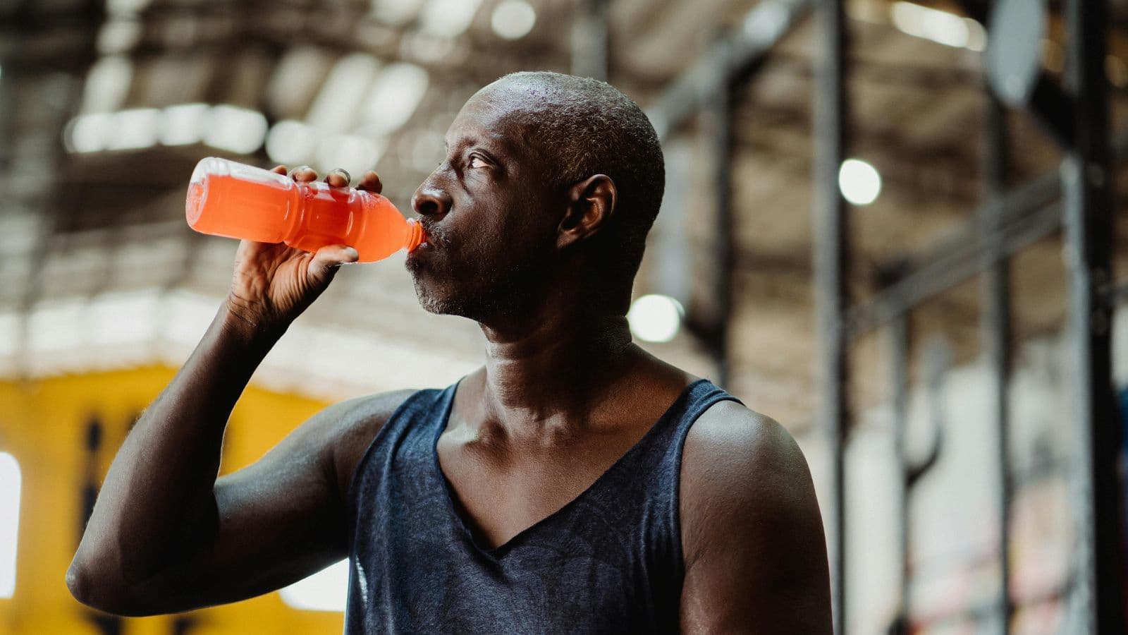 Runner drinking electrolytes during training to maintain hydration and support endurance performance