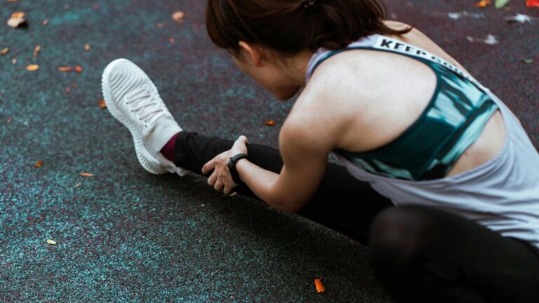 Runner training on road with focused form, building strength and endurance to prevent injuries