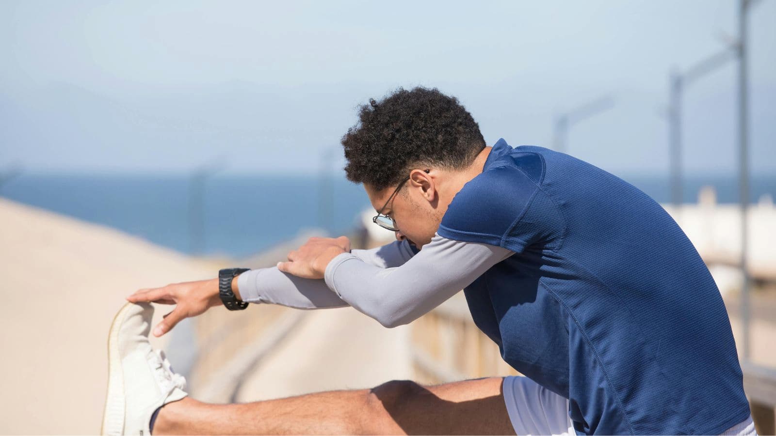 Runner preparing muscles with dynamic stretches before running session