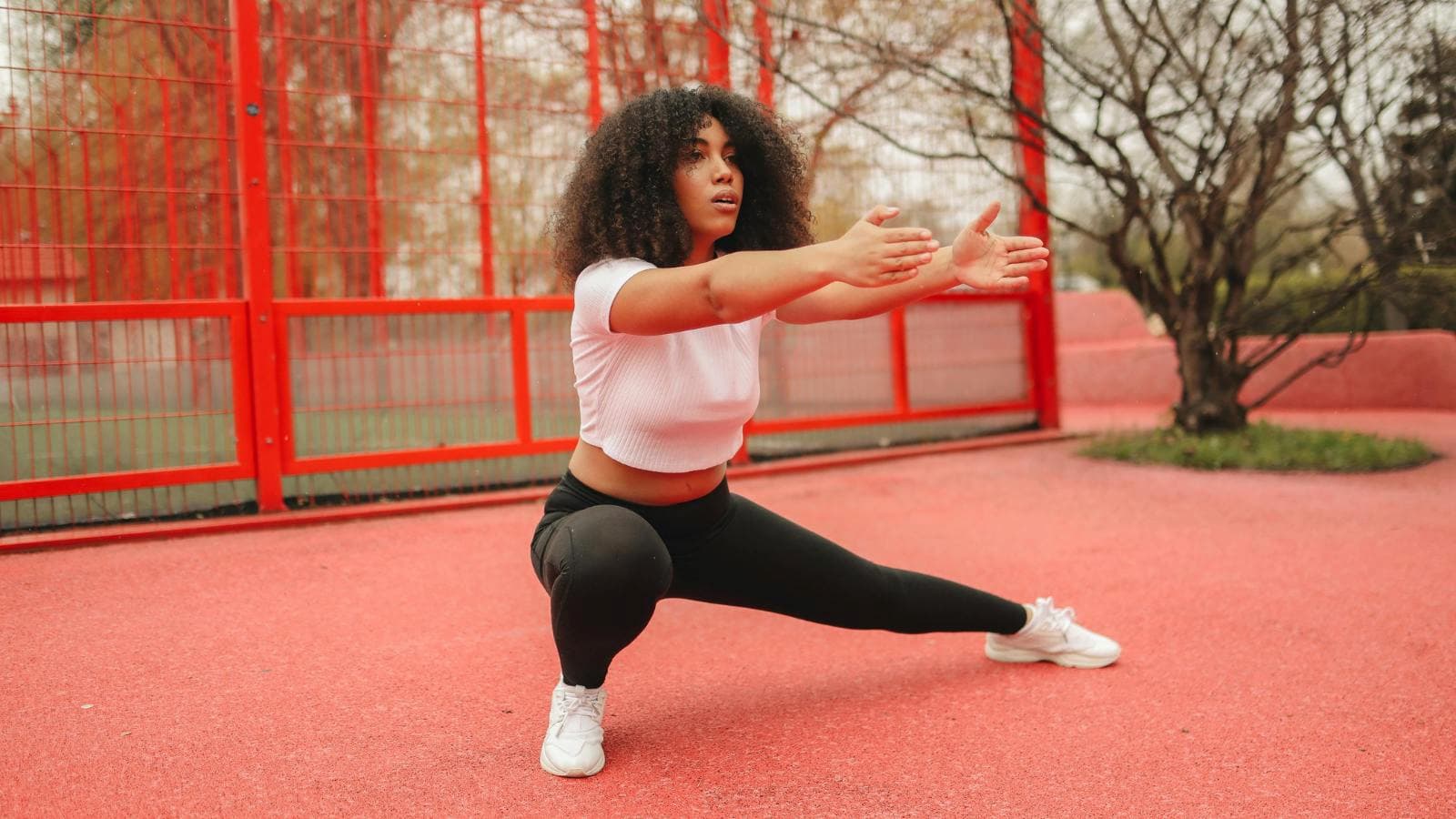 athlete performing hip mobility exercises to prevent running injuries and improve joint flexibility