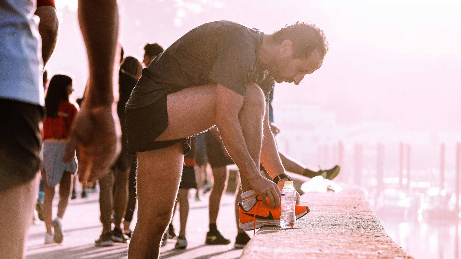 runner consuming energy gel and hydration during long distance race to maintain endurance and performance