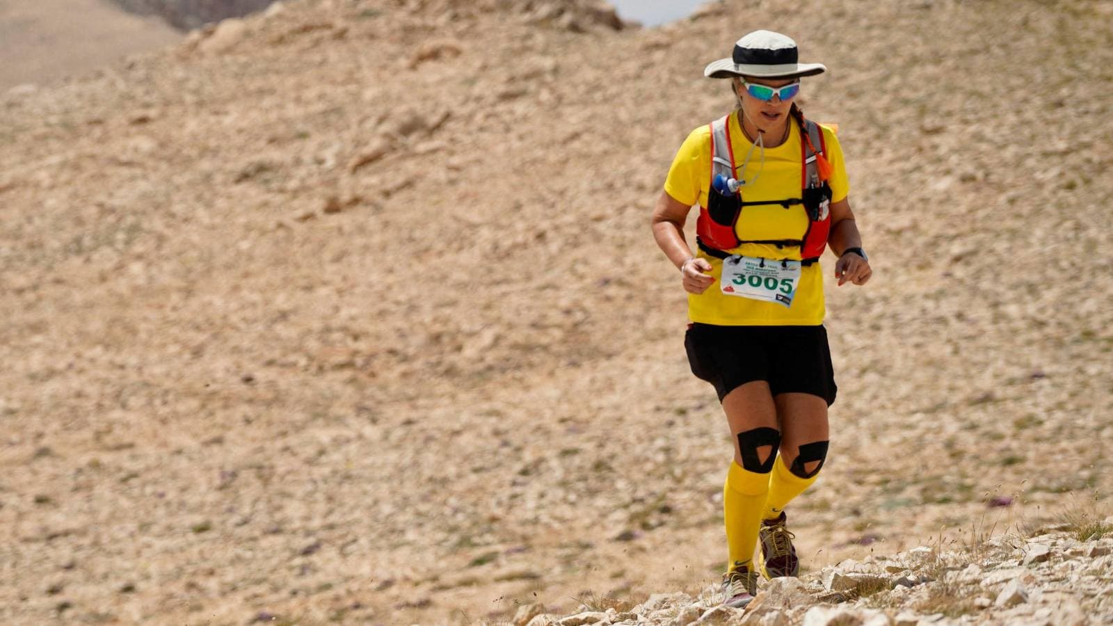 Ultramarathon runner competing in a long-distance race on an open trail or road, highlighting extreme endurance training, stamina, and preparation for first-time ultramarathon runners.
