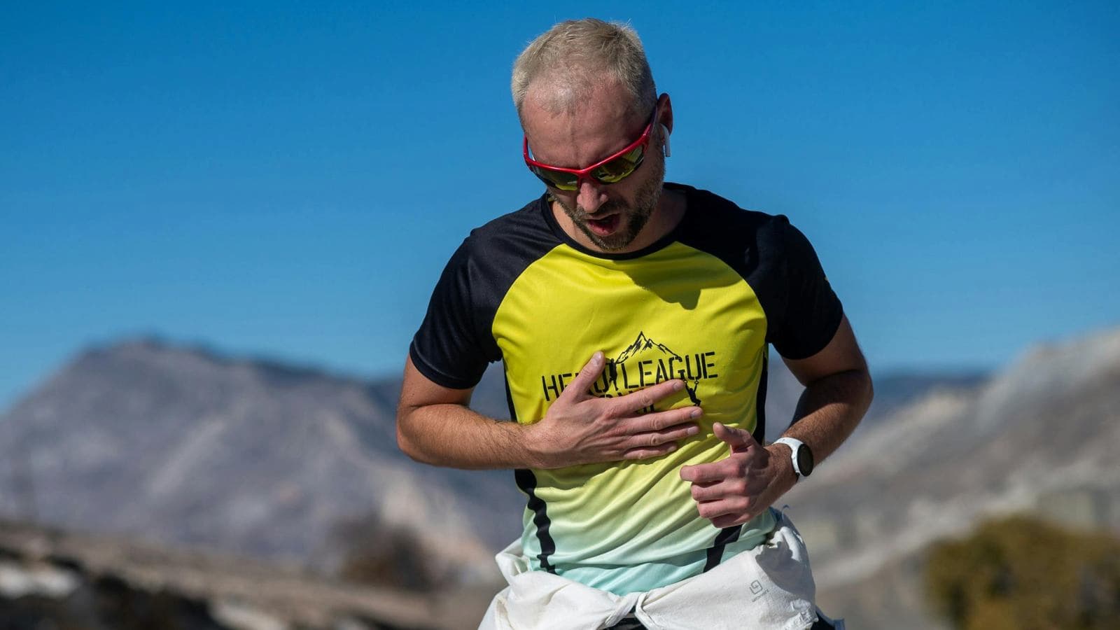 runner checking heart rate during easy run after noticing unusually high heart rate levels