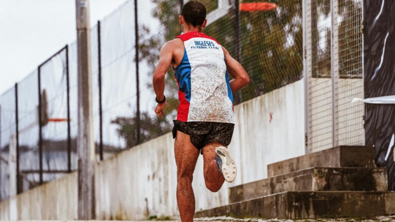 athlete reviewing marathon training schedule with planned rest and recovery days