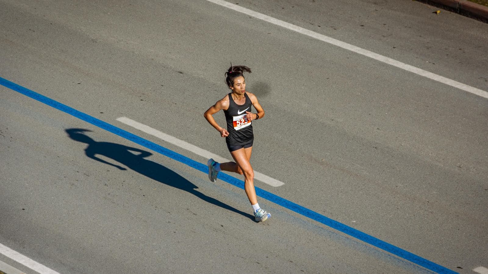 fatigued distance runner struggling in final miles after starting race too fast