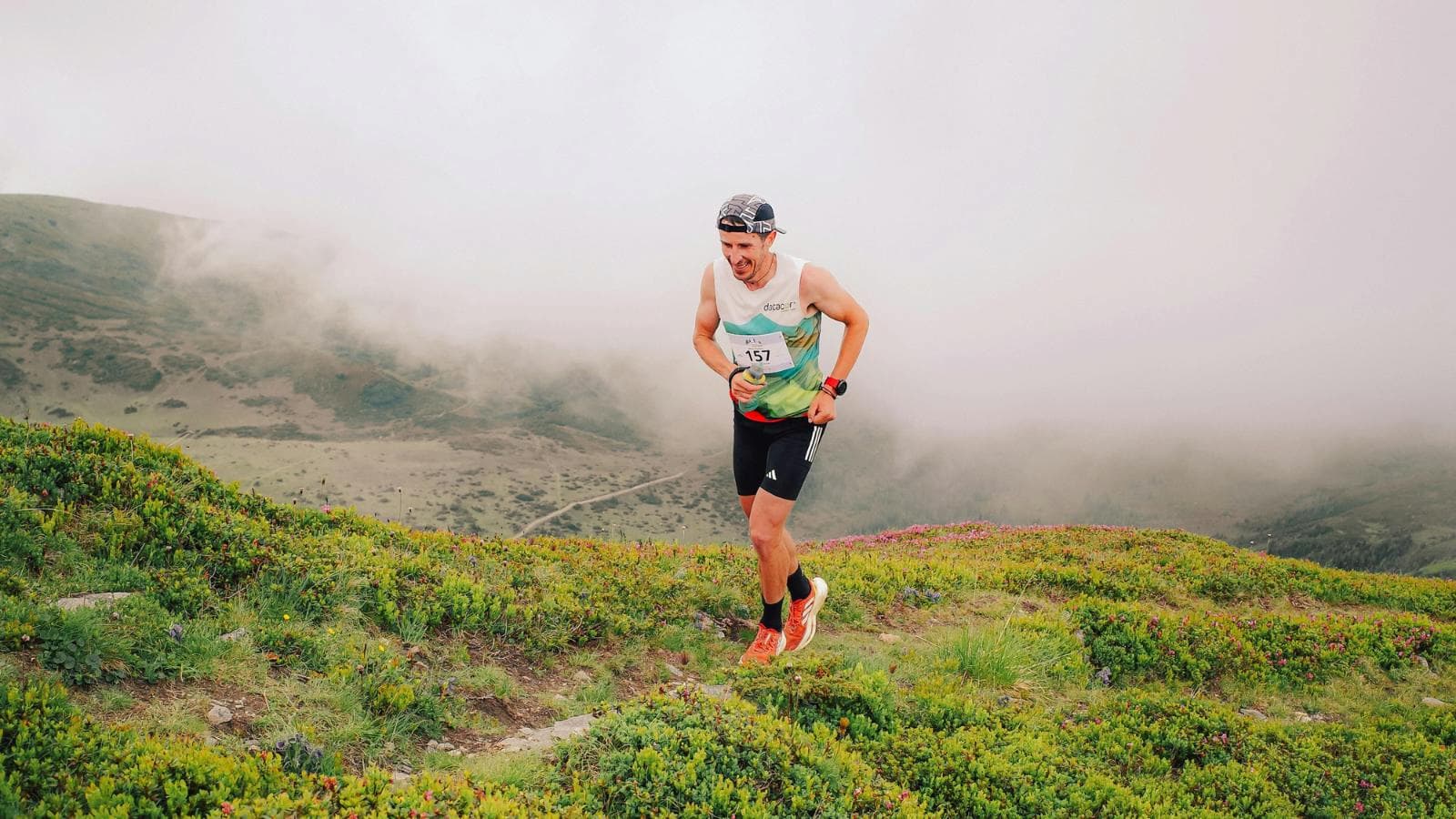 athlete running in mountainous environment to build endurance and altitude adaptation