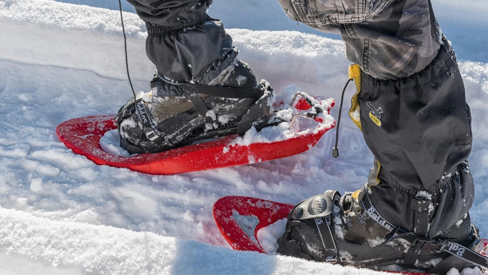 beginner snowshoe runner training on snowy trail during winter endurance workout