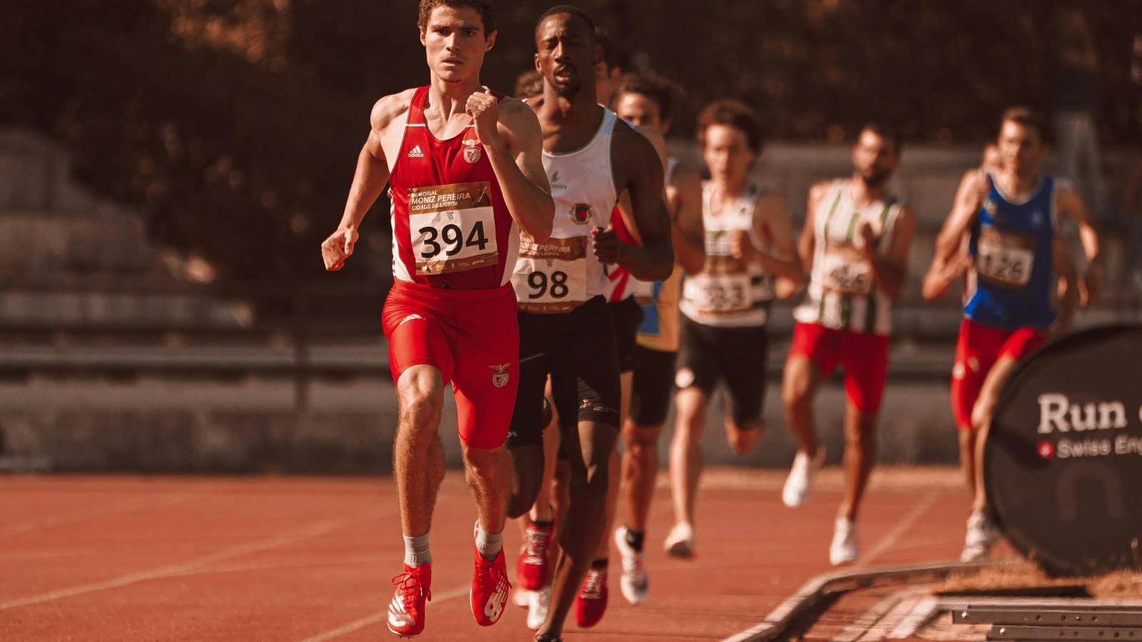 runners demonstrating proper running form with efficient posture stride and arm swing during training