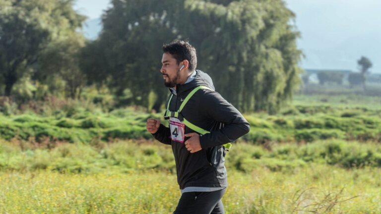 runner training consistently over time to improve endurance and achieve long term running success