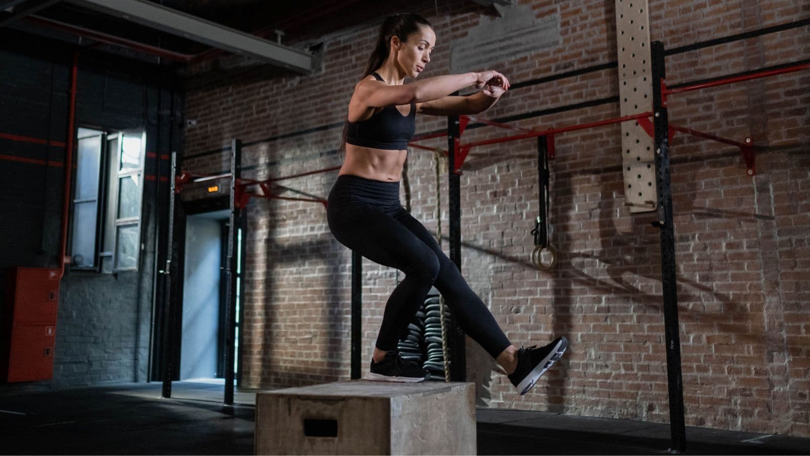 distance runner performing jump training and bounding drills as part of strength routine