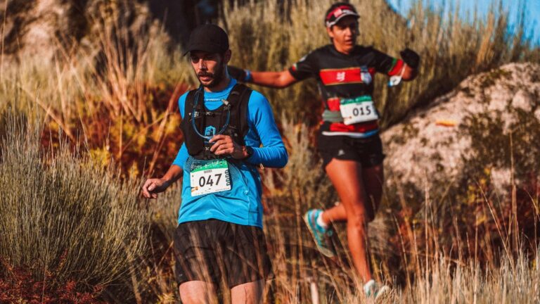trail runner enjoying scenic mountain trail while staying motivated and having fun during training