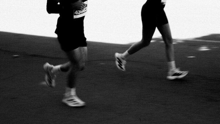 trail runner training on paved road to improve endurance and support trail running performance