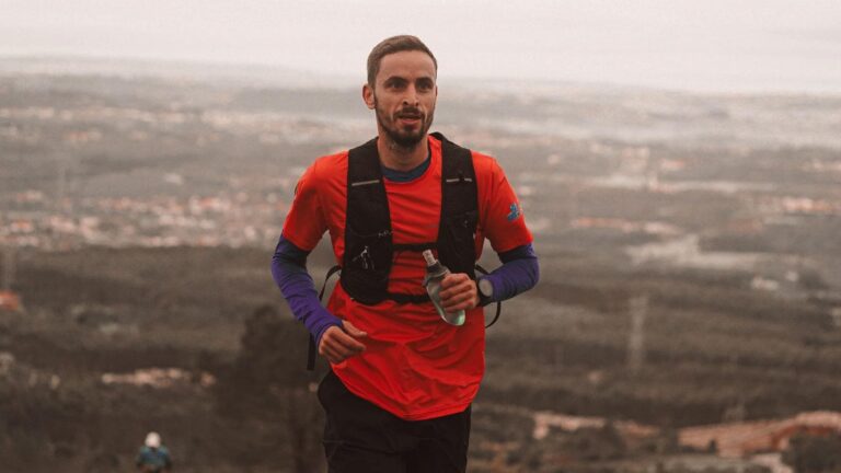 trail runner preparing energy snacks and hydration before a long trail running session