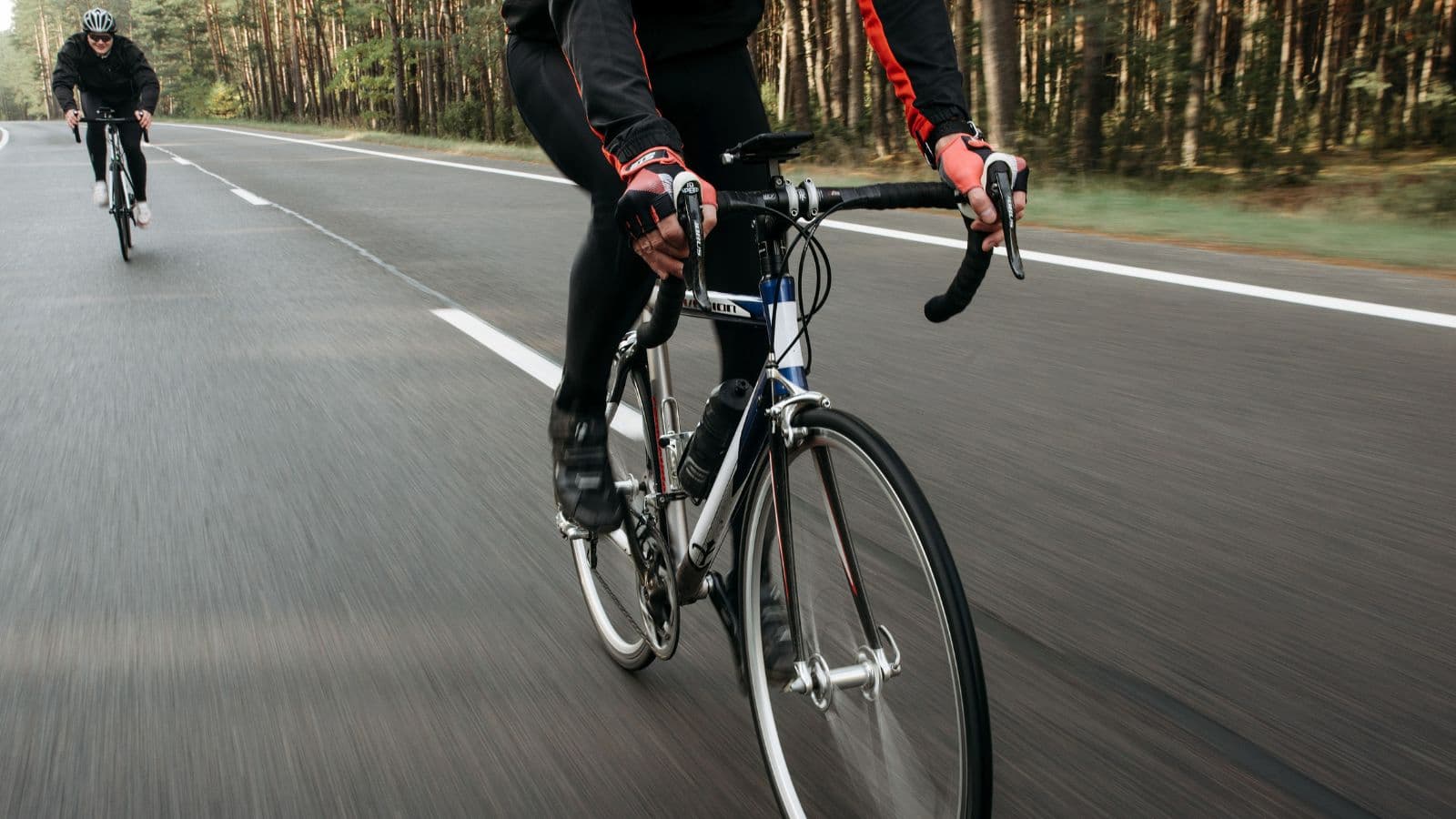 trail runner cross training on road bike to improve endurance strength and trail running performance