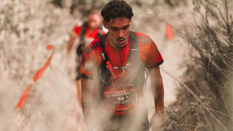 Trail runner finishing a long training run with relaxed form and controlled breathing after building endurance through consistent training.