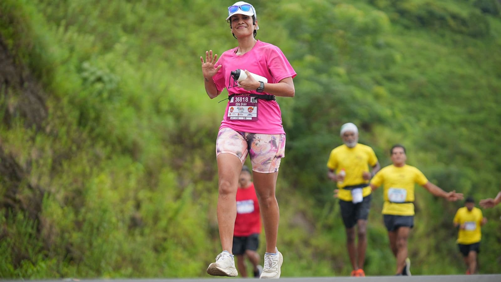 Trail runner maintaining a comfortable, steady pace on a scenic forest trail to improve endurance without excessive fatigue.