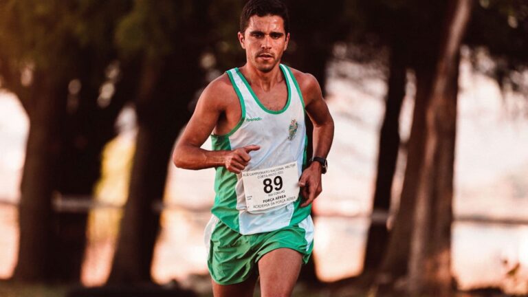 beginner marathon runner organizing race bib shoes and nutrition during marathon race week
