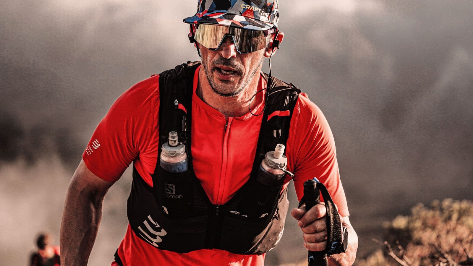 Trail runner training on a woodland trail to build endurance and confidence before a first 10K trail race.