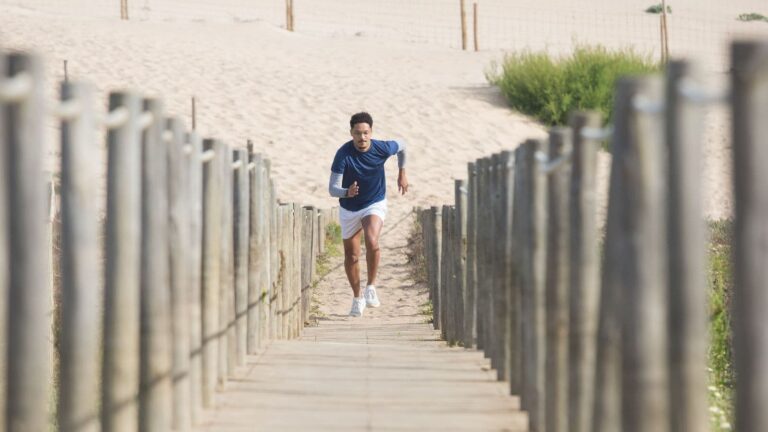 Beginner runner completing an easy outdoor run as part of a structured weekly running program.