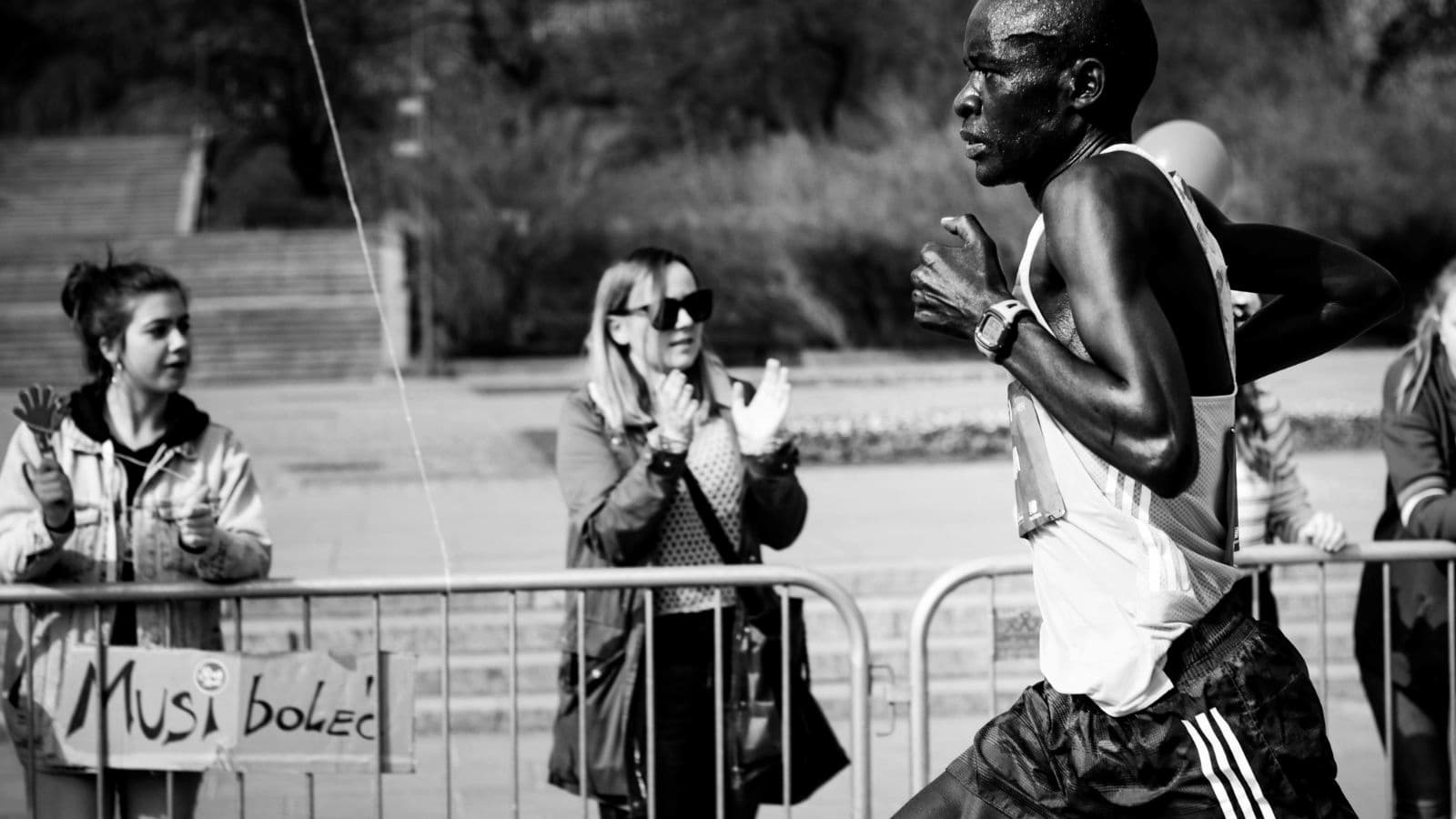 runner smiling during long distance run while experiencing runner's high and improved mood