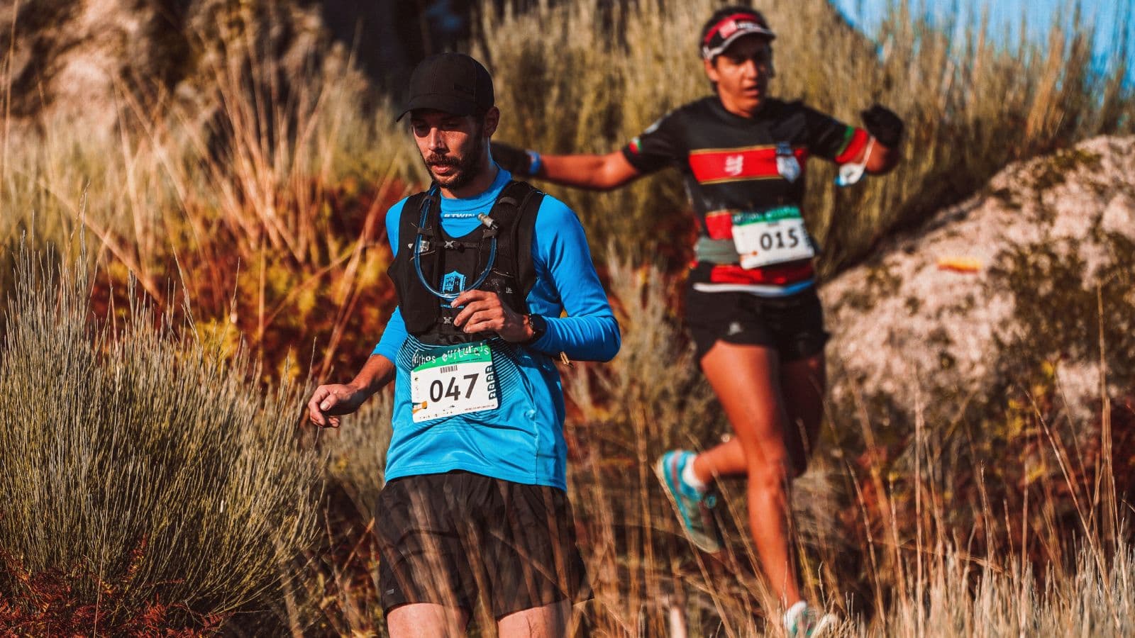 Trail runner finishing a long trail run with relaxed running form and controlled breathing on rolling terrain.