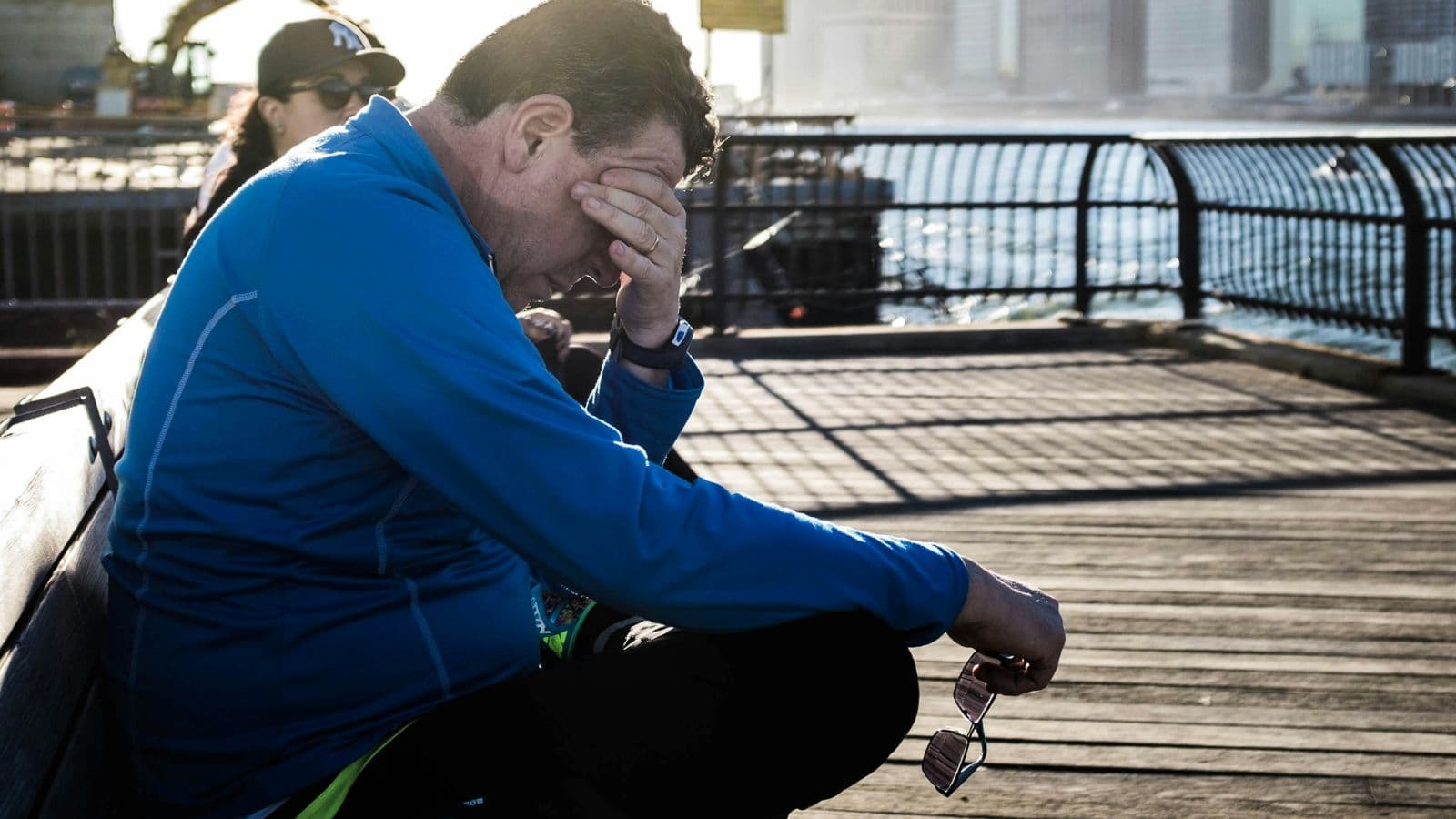 trail runner checking training plan before early morning trail run to manage time effectively