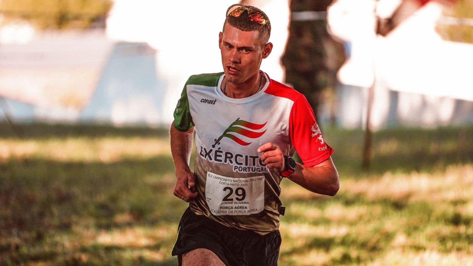 Trail runner maintaining a relaxed, conversational pace on a forest trail during an easy endurance training session.