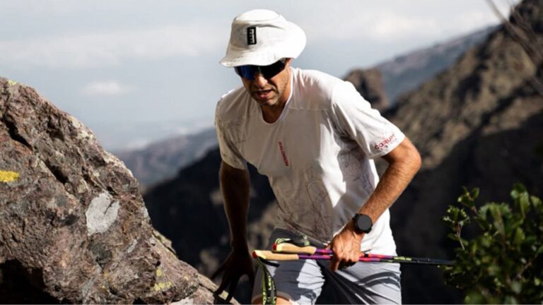 Trail runner focusing on reaching the next section of a long trail while managing mental fatigue during an endurance run.