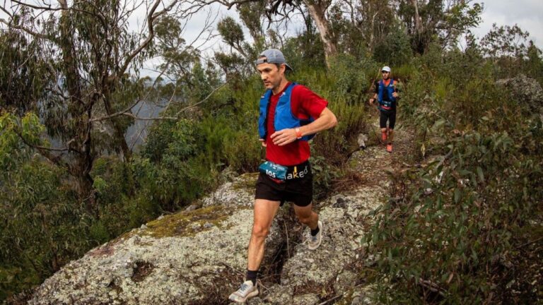 Beginner runner taking an easy recovery walk after a running race to support recovery before their next event.
