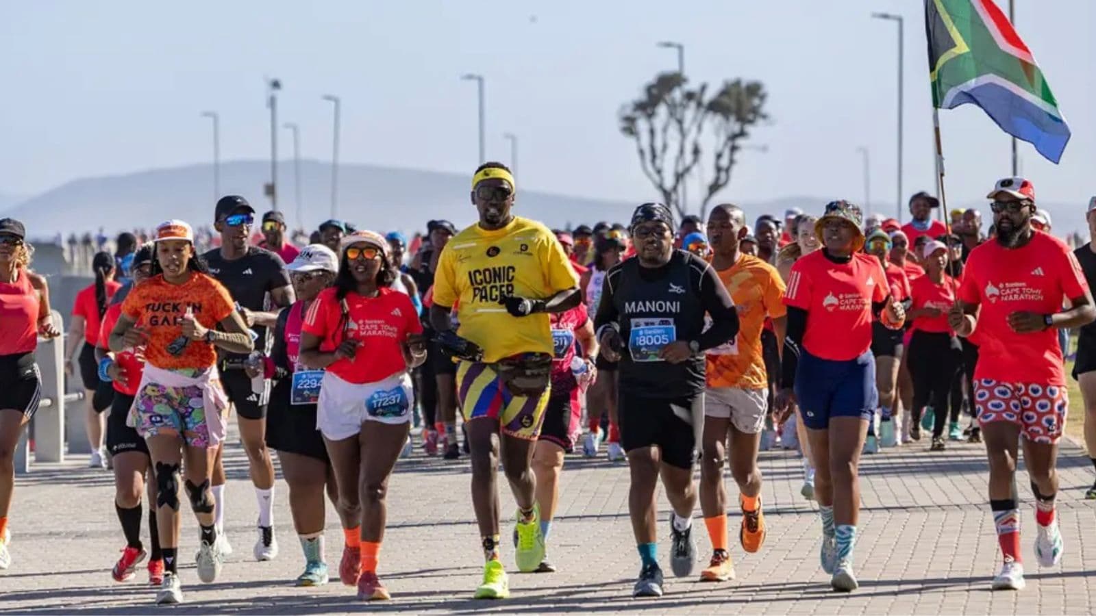 Marathon runner training outdoors in changing weather conditions to prepare for unpredictable race-day temperatures.