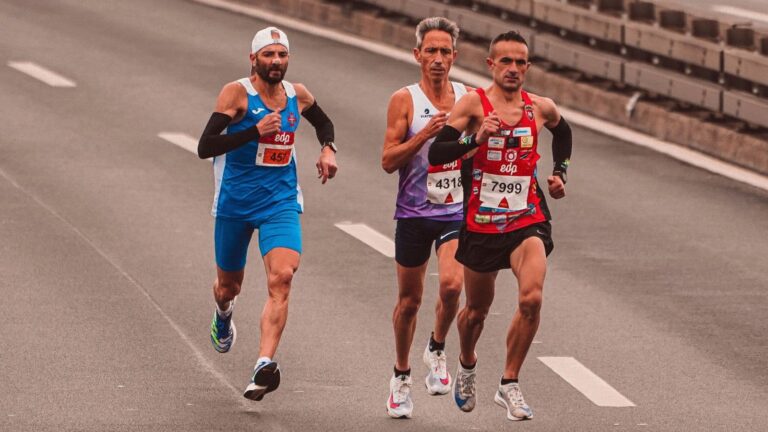 Close-up of a runner showing relaxed elbow position and forward-to-back arm movement during an endurance run.