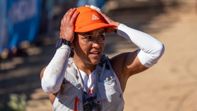 Marathon runner feeling extremely exhausted & defeated near the finish line