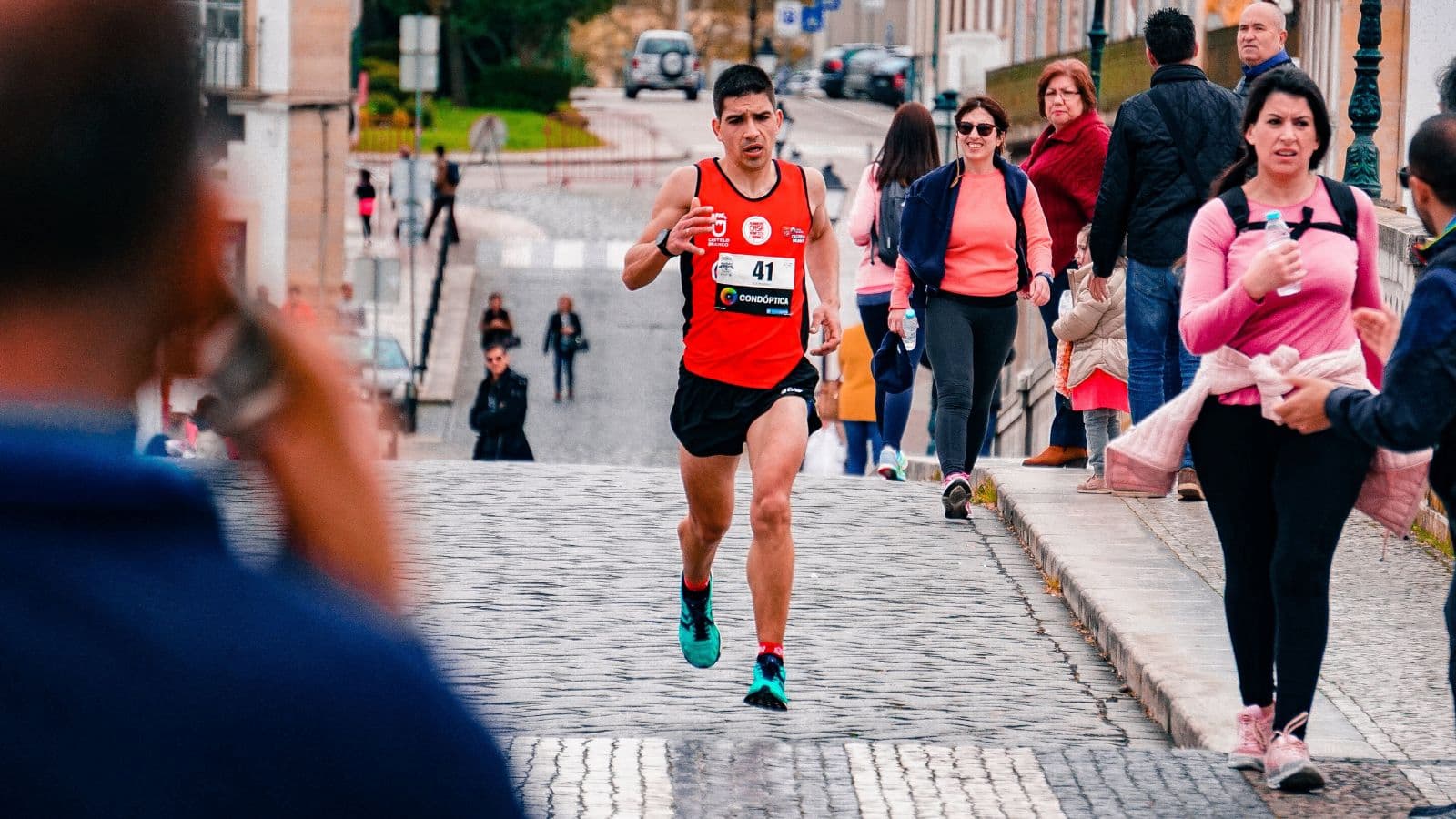 Runner stopping during a training run because of recurring lower-leg discomfort caused by repetitive running stress.
