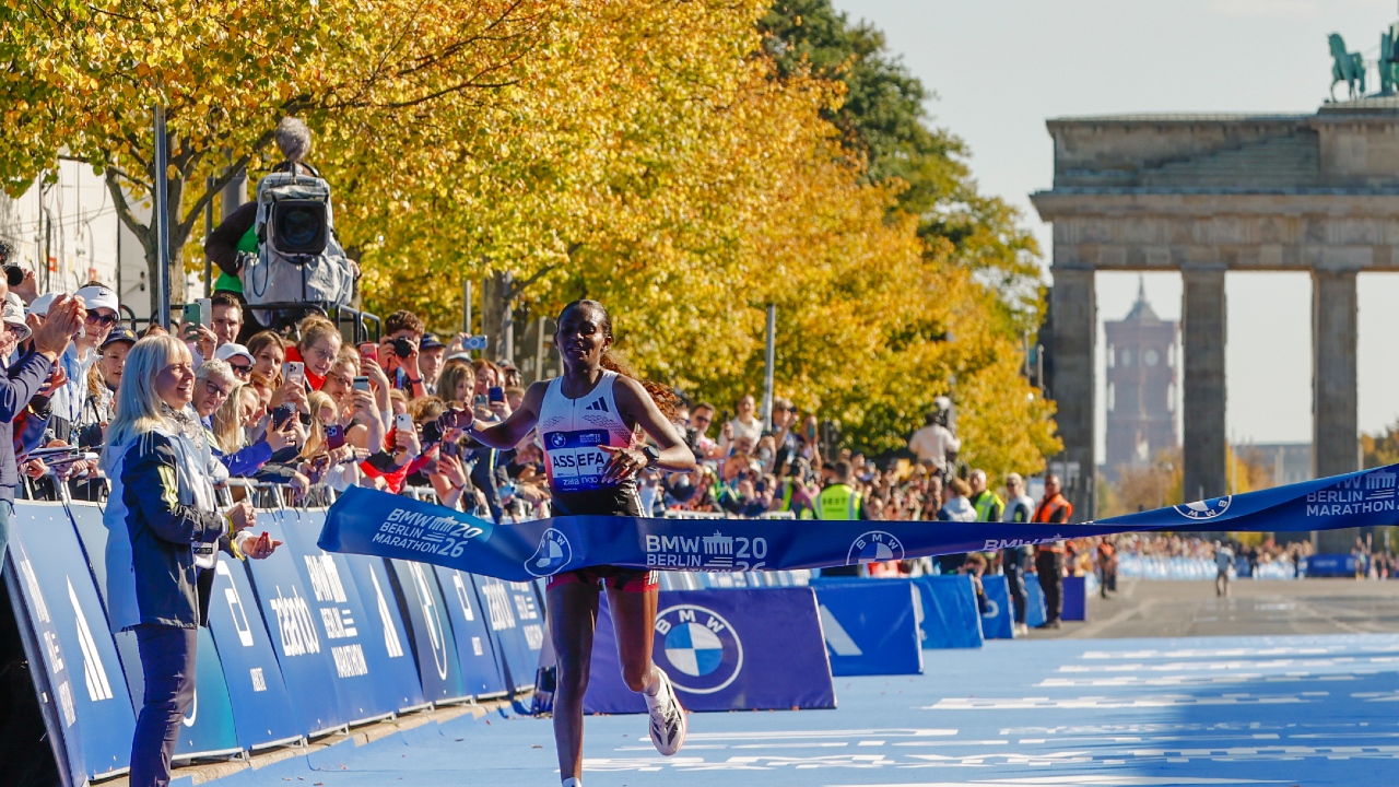 Tigst Assefa crosses line Berlin Marathon 2026