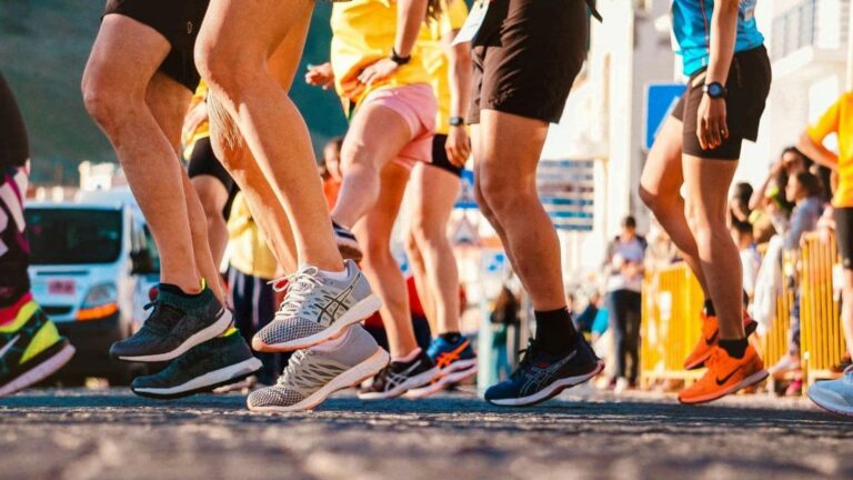 Distance runner completing a demanding long run after increasing weekly mileage and training intensity.