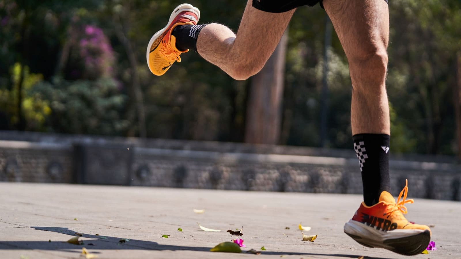 Rear view of a runner’s foot and ankle showing natural inward movement during the running gait cycle.
