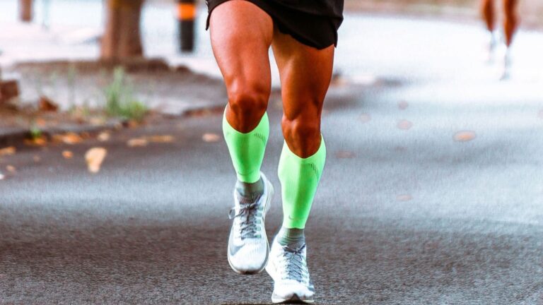 Distance runner completing a high-mileage training week after rapidly increasing running volume and workout intensity.