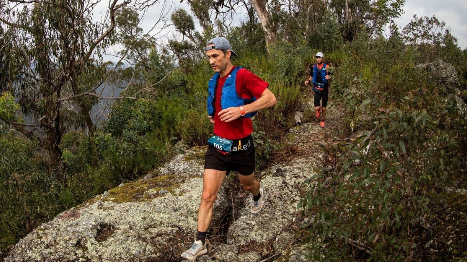 Trail runner completing a steady training run while gradually increasing distance and difficulty on forest trails.