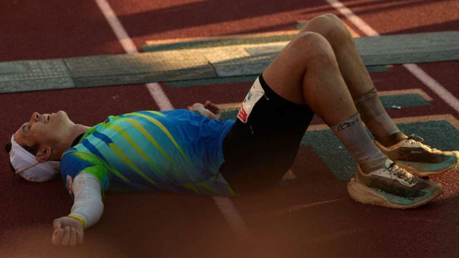 Marathon runner struggling with heavy legs and severe fatigue after depleting much of their available glycogen late in a race.
