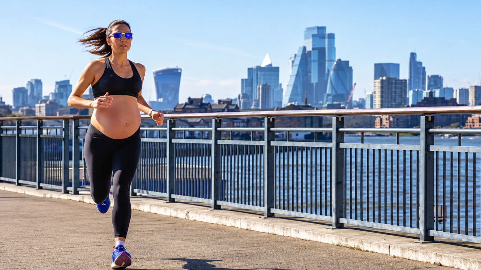 Pregnant runner maintaining a comfortable pace during an outdoor running session as part of an adjusted training routine.