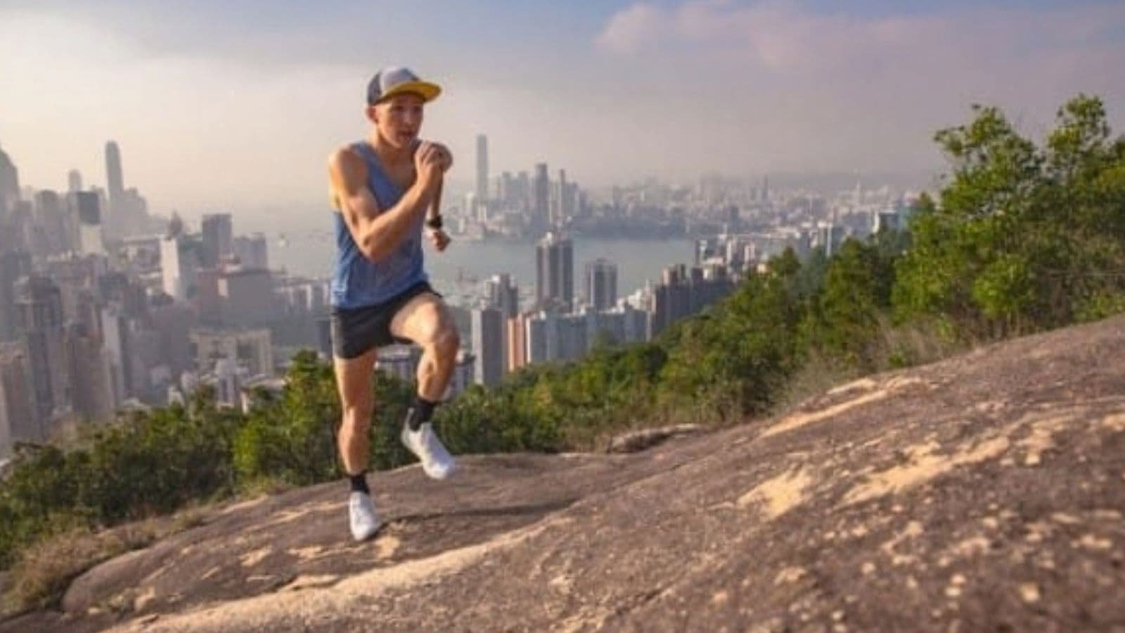 Beginner trail runner completing a comfortable training run on a gentle woodland trail while gradually increasing weekly mileage.